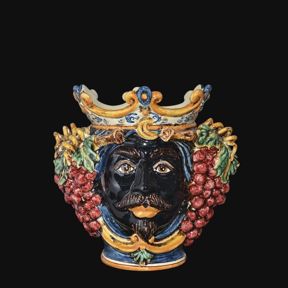 Ceramiche di Caltagirone fatti a mano con volto barbuto, corona e grappoli d'uva colorati