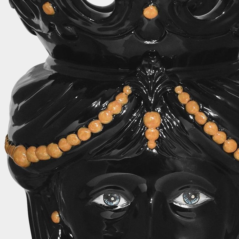 Ceramiche di Caltagirone fatti a mano, scultura nera con occhi azzurri e dettagli arancioni