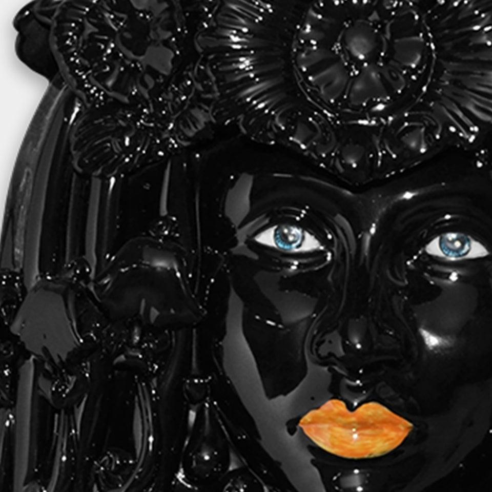 Ceramiche di Caltagirone fatti a mano: maschera nera lucida con occhi azzurri e labbra arancioni