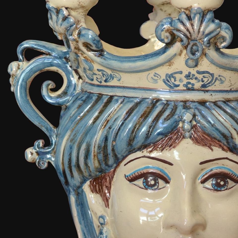 Ceramiche di Caltagirone fatti a mano con volto femminile e decori blu