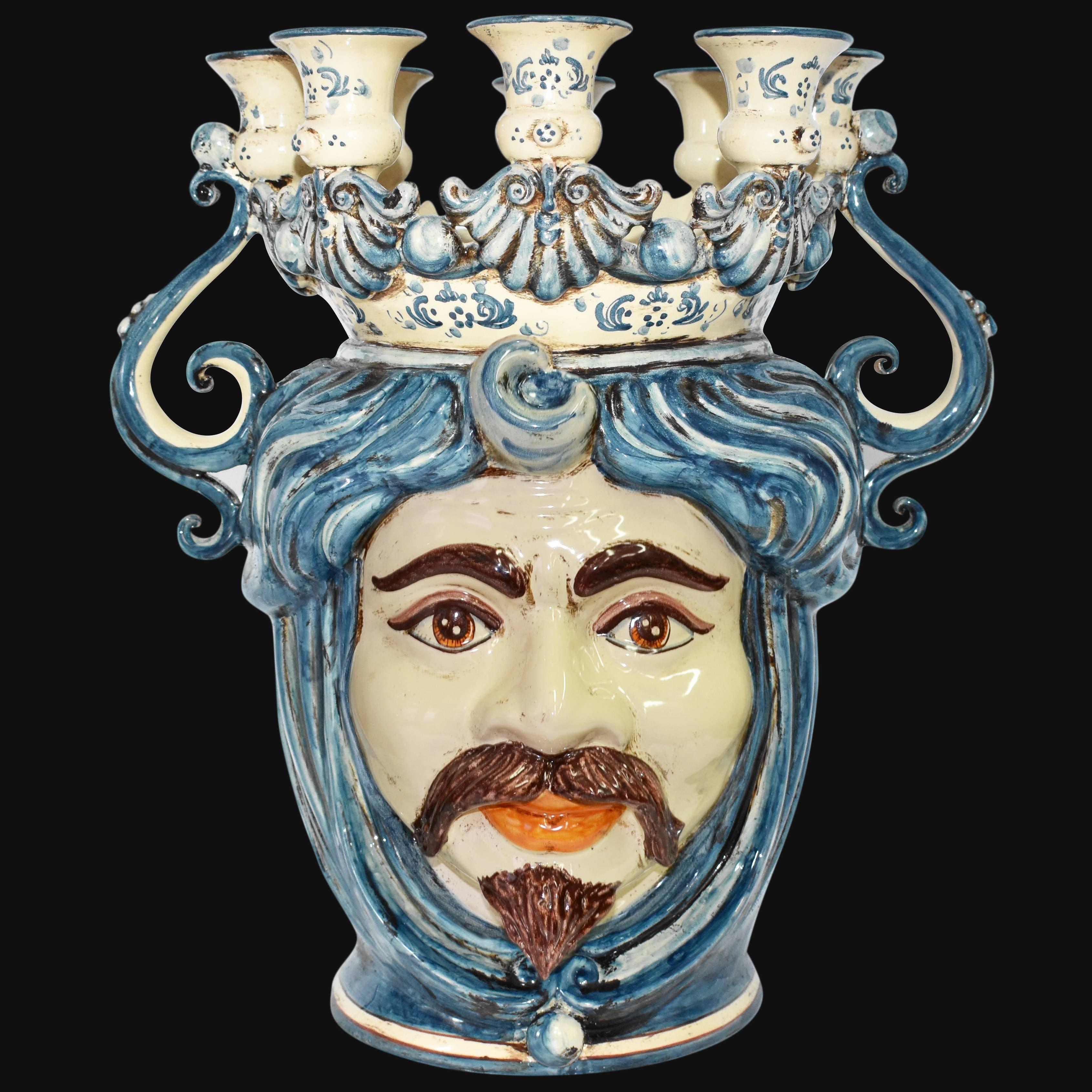 Ceramiche di Caltagirone fatti a mano con volto barbuto e candelabro blu e crema